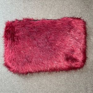 Burgundy (EUC) faux fur clutch. One size.